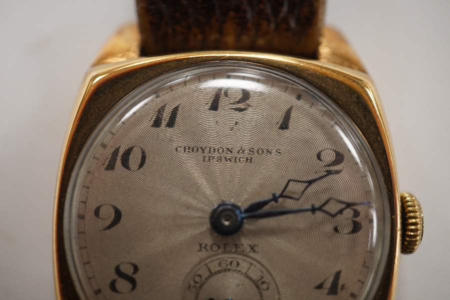 A gentleman's 1930's yellow metal Rolex manual wind wrist watch, retailed by Croydon & Sons, Ipswich, with Arabic dial and subsidiary seconds, the case back numbered 554 over 37665, case diameter 26mm, on a late associat